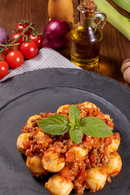 Premium Photo | Bolognese gnocchi with natural organic tomato sauce ...