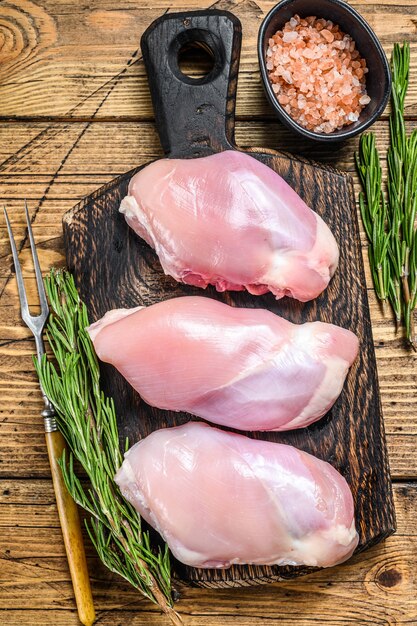 Premium Photo Boneless Raw Chicken Thigh Fillet Wooden Background