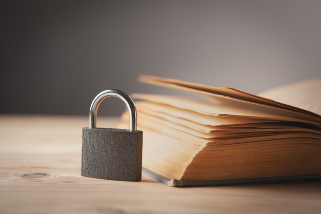 premium-photo-book-and-lock-on-a-wooden-table-hidden-knowledge