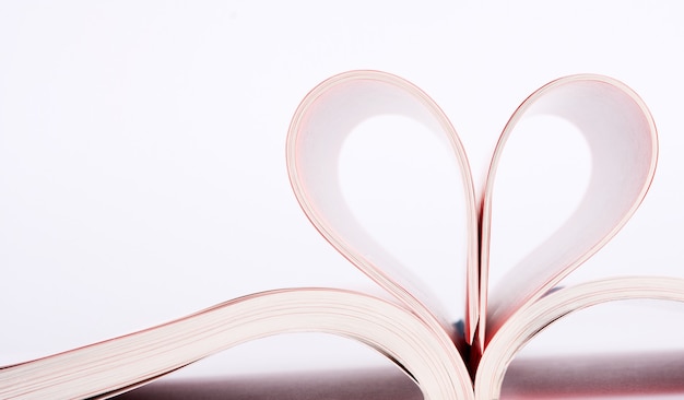 Premium Photo | Book pages folded into a heart shape