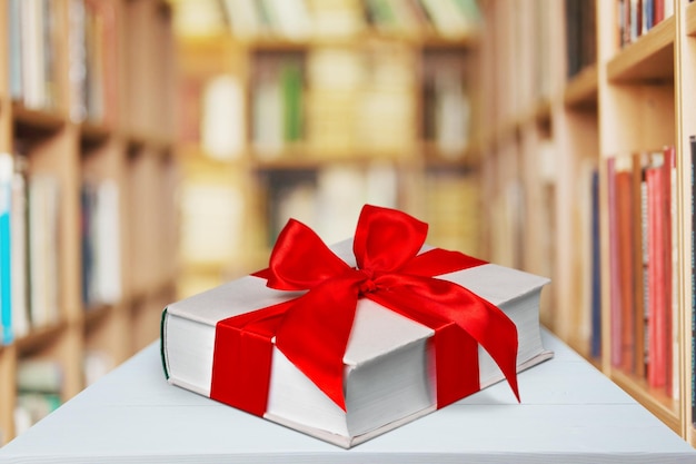 Premium Photo | Book wrapped with a ribbon