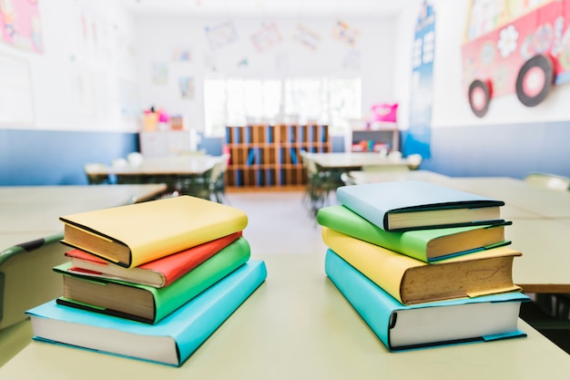 Books on table in classroom Free Photo