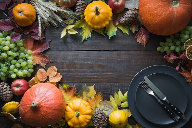 Premium Photo | Border of fall harvest, pumpkins, dry leaves, grapes