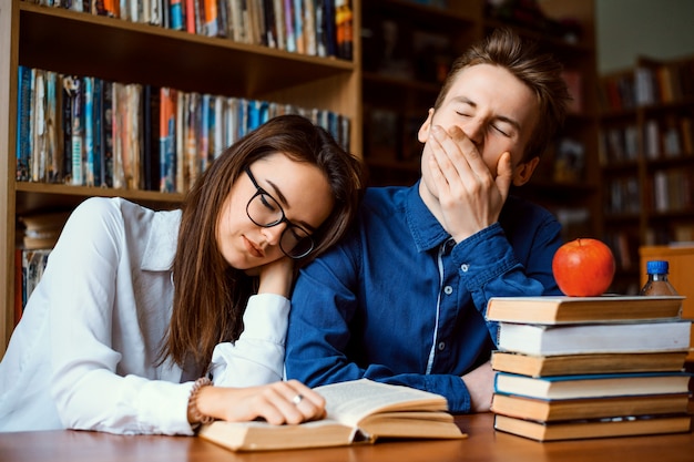 Premium Photo Bored Students Tired Of Constant Studying Fell Asleep While Working On Project Whole Day