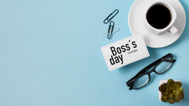 Free Photo | Boss's day assortment on blue background with copy space