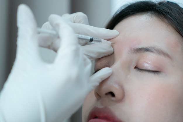 Premium Photo | Botox, filler injection for asian female face. plastic  aesthetic facial surgery in beauty clinic.
