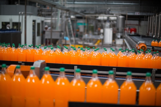 Premium Photo | Bottle of juice processing on production line