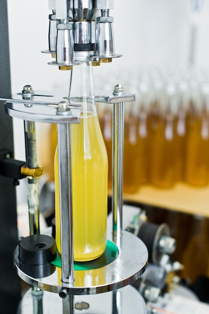 Premium Photo | Bottling factory beer bottling line for processing and ...