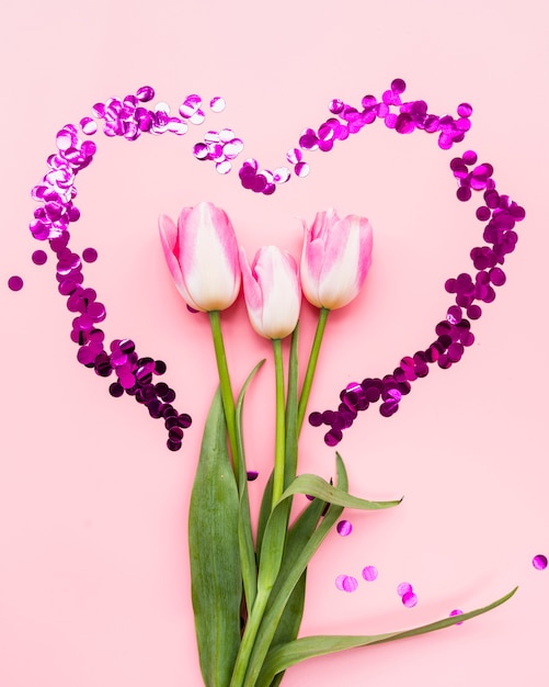 Download Bouquet of flowers in heart frame on pink background ...