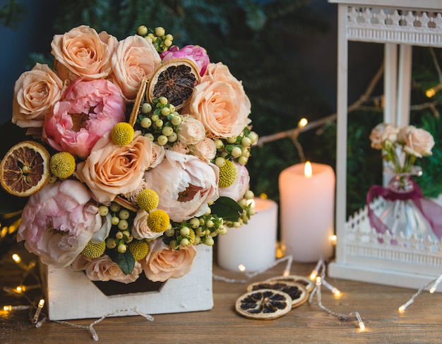 Bouquet Of Holly Berries Peonies And Dry Lemon Slices Free Photo