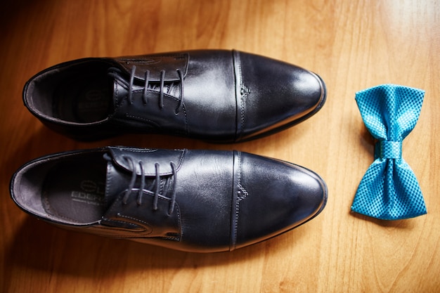 Premium Photo | Bow tie and shoes of 