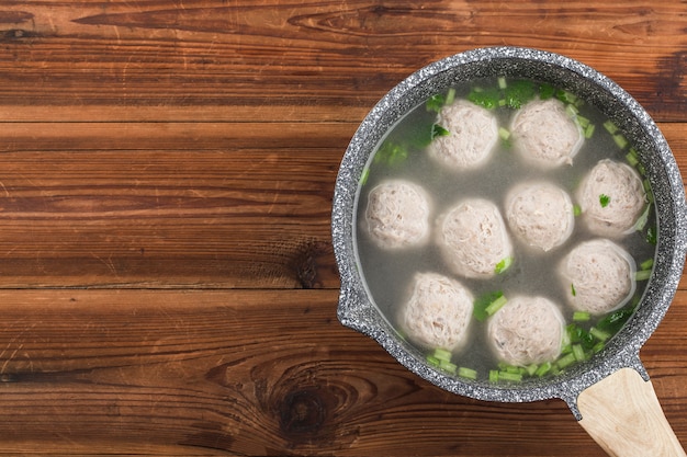 premium photo a bowl of beef ball soup on a wooden board background https www freepik com profile preagreement getstarted 7093653