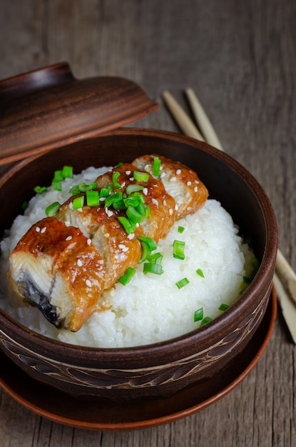 Premium Photo Bowl Of Rice Topped With Broiled Eel In Unagi Sauce