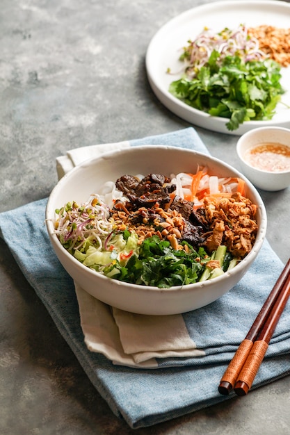 Premium Photo | Bowl of traditional vietnamese noodle salad - bun bo ...