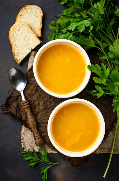 Premium Photo | Bowls of hot vegetarian red lentil soup