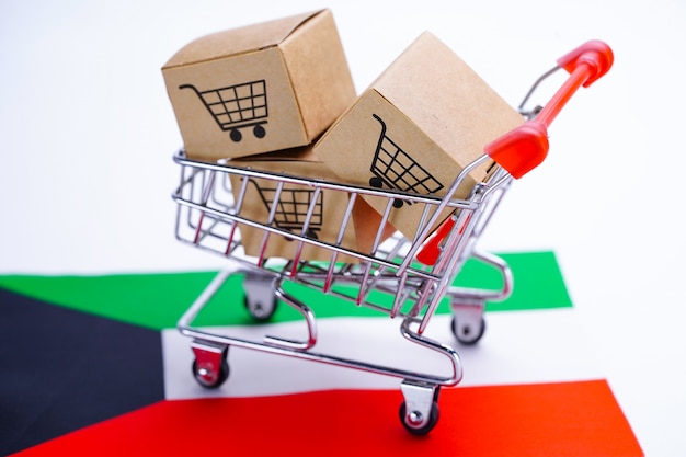 Box with shopping cart logo and kuwait flag. Premium Photo