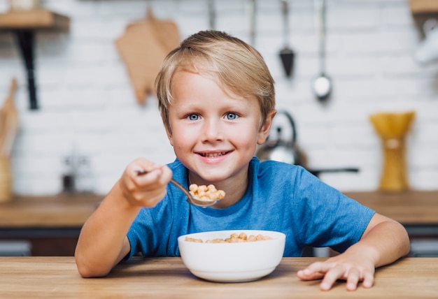 Free Photo | Little Boy Eating Cereals With Milk