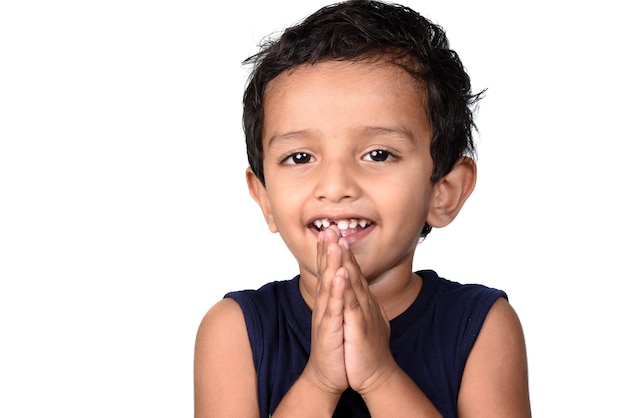 Premium Photo Boy Greeting Namaste Kid Folded Hands Representing Traditional Indian Greeting Namaste Welcome Isolated On White