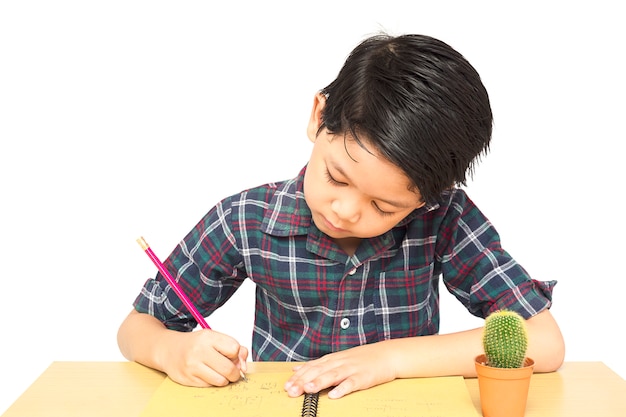 A boy is curiously doing homework