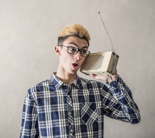 Premium Photo | Boy listening to radio