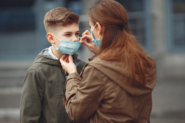 A boy and mother are wearing protective masks Free Photo