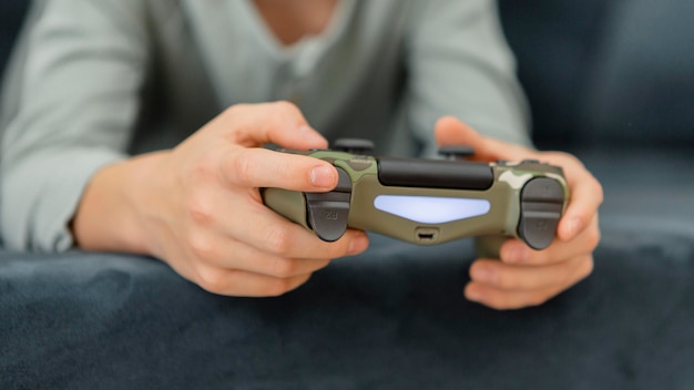 Free Photo | Boy playing with a controller