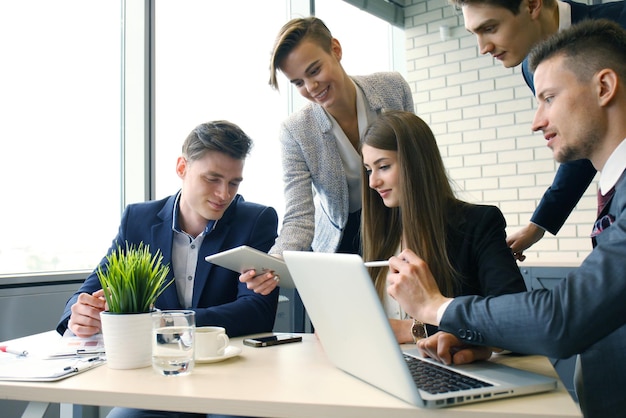 Premium Photo | Brainstorm. group of business people looking at the ...