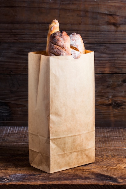 Download Bread rolls tucked into a paper bag Photo | Free Download