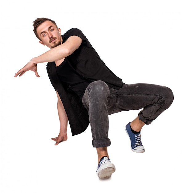 Break dancer doing one handed handstand against a white background Free Photo