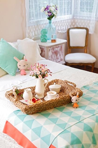 Premium Photo Breakfast In Bed Wicker Tray With A Cup Of Coffee With Milk Cookies And Flowers