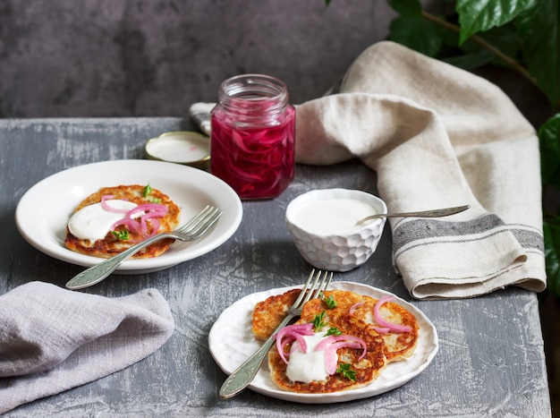 Premium Photo Breakfast Made From Traditional Boxty Fritters Or Latkes Served With Pickled Onions And Sour Cream