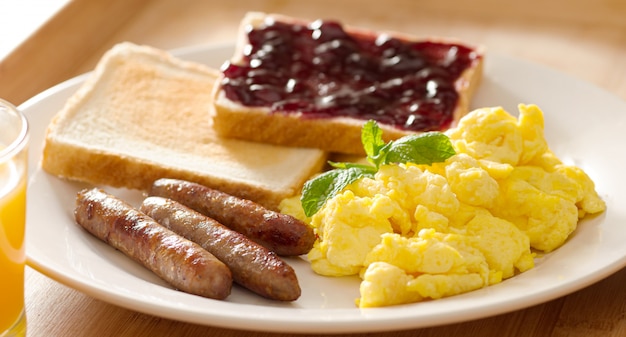 Premium Photo Breakfast With Scrambled Eggs Sausage Links And Toast