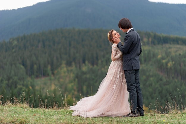 https://image.freepik.com/free-photo/bride-groom-celebrate-their-wedding-mountains-wedding-photography-wedding-ceremony-two_192420-2788.jpg