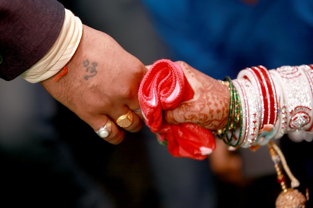 Premium Photo | A bride & groom hand' together in indian wedding