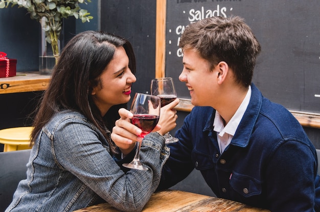 Znalezione obrazy dla zapytania: couple locking arms, holding glass of wine free pictures