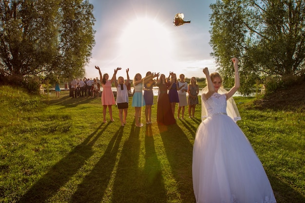 premium-photo-the-bride-throws-a-bouquet