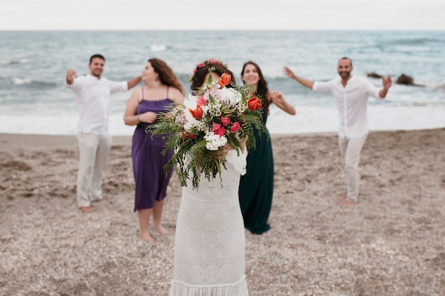 Bride wanting to throw her flower bouquet Free Photo