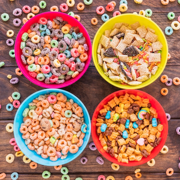 Free Photo | Bright bowls with cereals on wooden table