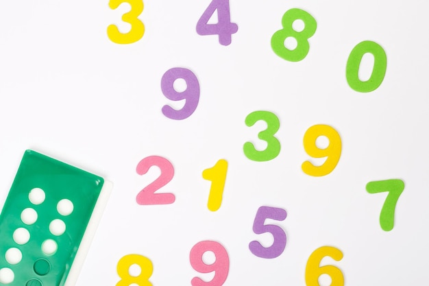 Premium Photo | Bright coloured foamed numbers and counting tool ...