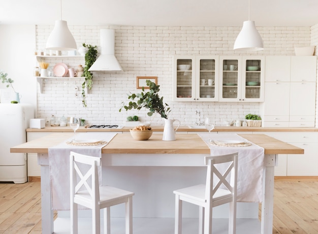 Bright cosy modern kitchen with island Premium Photo