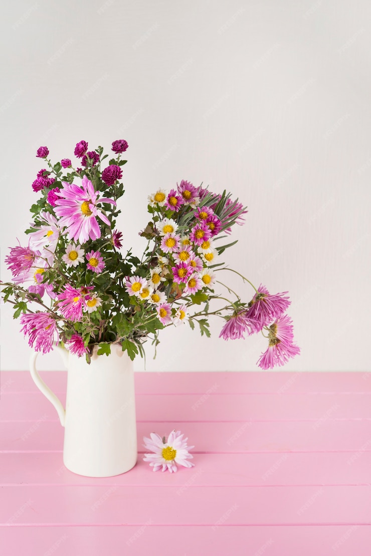 Free Photo | Bright flowers in vase on table