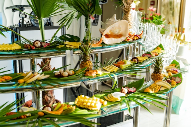 Premium Photo | Brightly decorated buffet with different exotic fruits ...