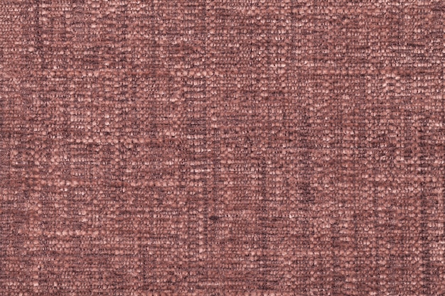Brown fluffy background of soft, fleecy cloth. texture of textile closeup Premium Photo