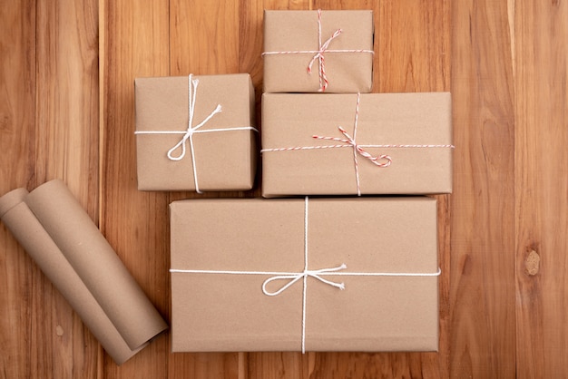 Brown Padded Package With Brown Paper Laid On Wooden Floor