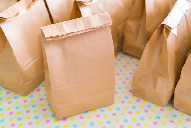 Brown paper bags on table . Free Photo