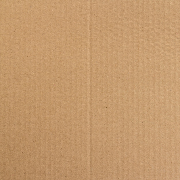 Brown paper box or corrugated cardboard sheet texture background Premium Photo