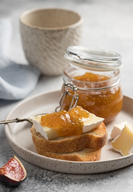 Premium Photo | Bruschetta with brie cheese and fig jam on ceramic ...