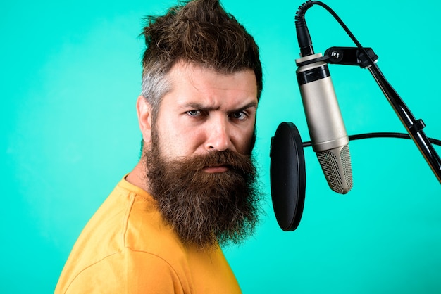 Premium Photo Brutal Bearded Singer With Microphone On Stage Bearded