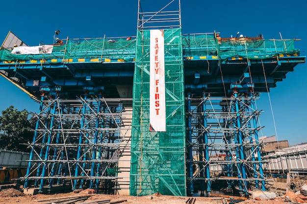 premium-photo-a-building-under-construction-with-safety-first-banner