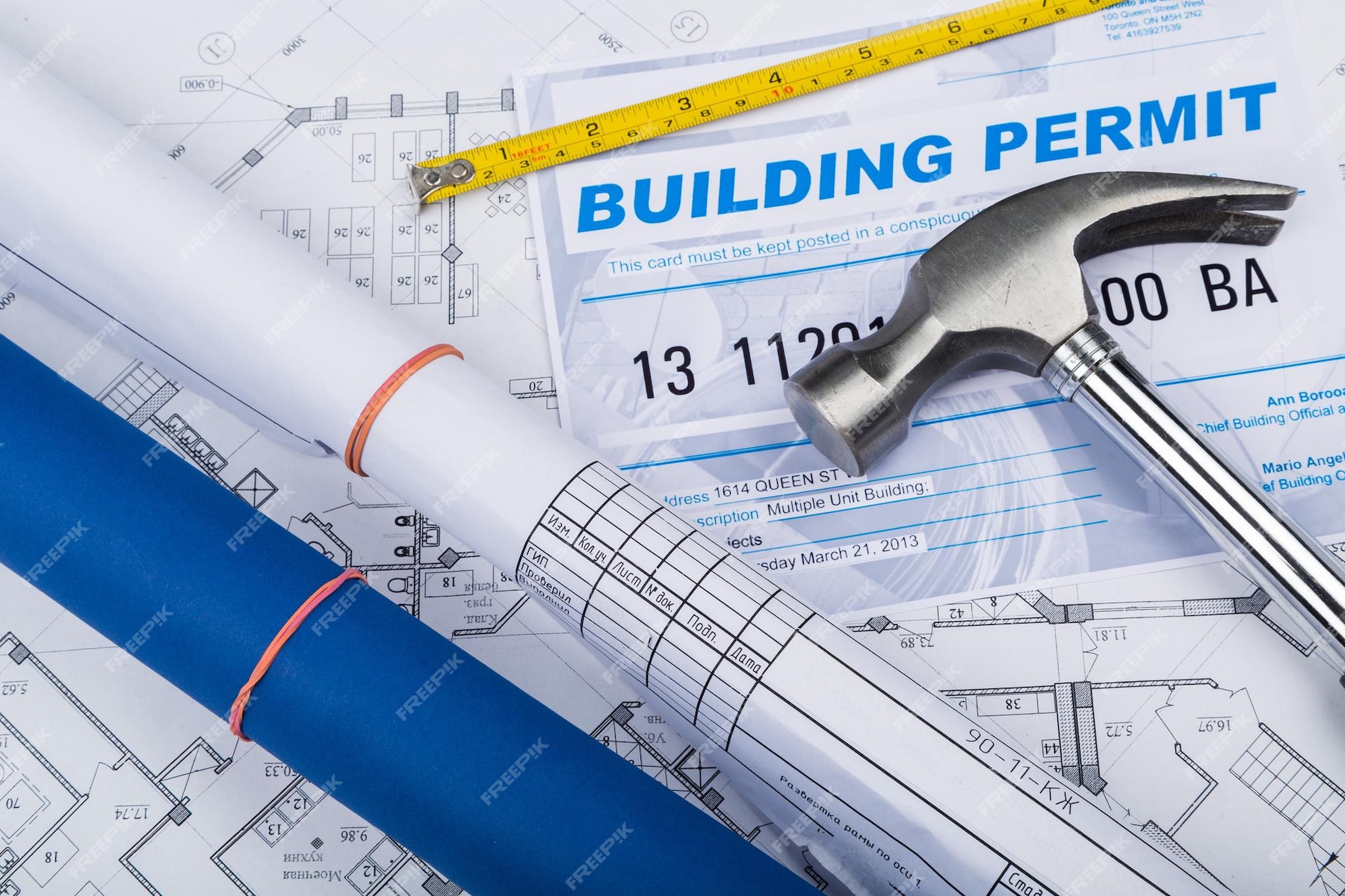 premium-photo-building-permit-concept-with-papers-and-hammer